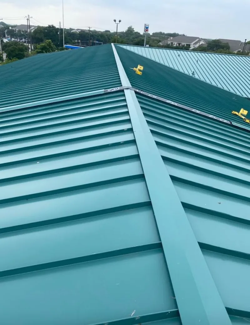 Green commercial metal roof ridge and valley for Metal Roof Repair in Salida del Sol Estates